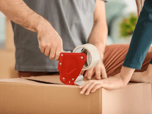 Putting Packing Tape on Box