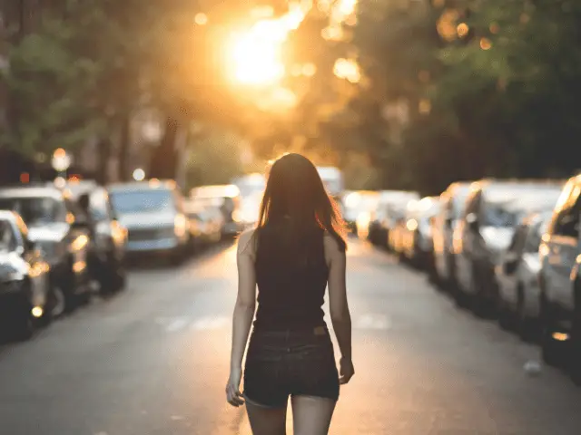 Woman Standing Alone in the Street