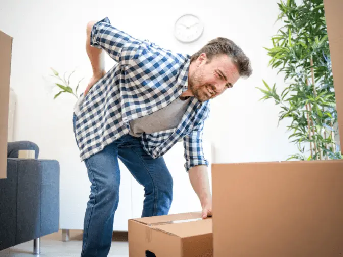 Man with Hurt Back from Lifting Heavy Box